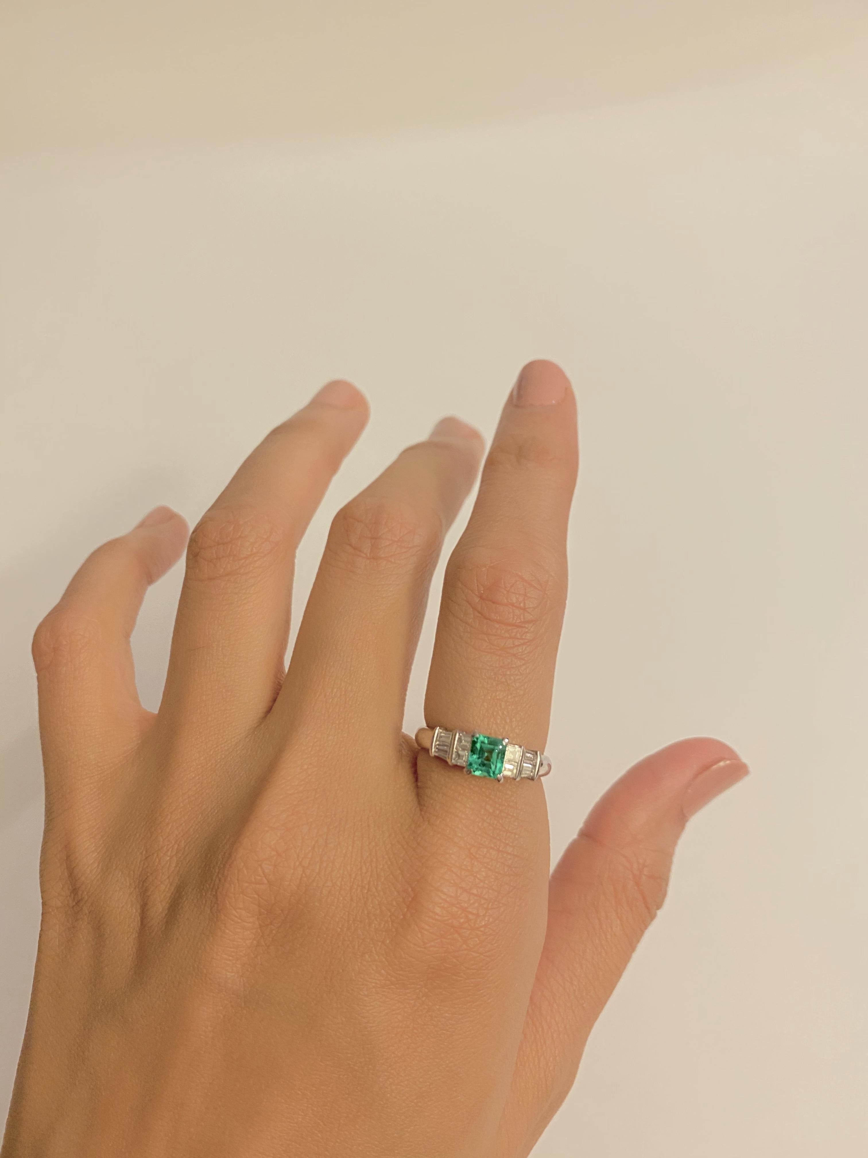 Platinum Ring with 0.55ct Emerald and 0.38ct Diamond