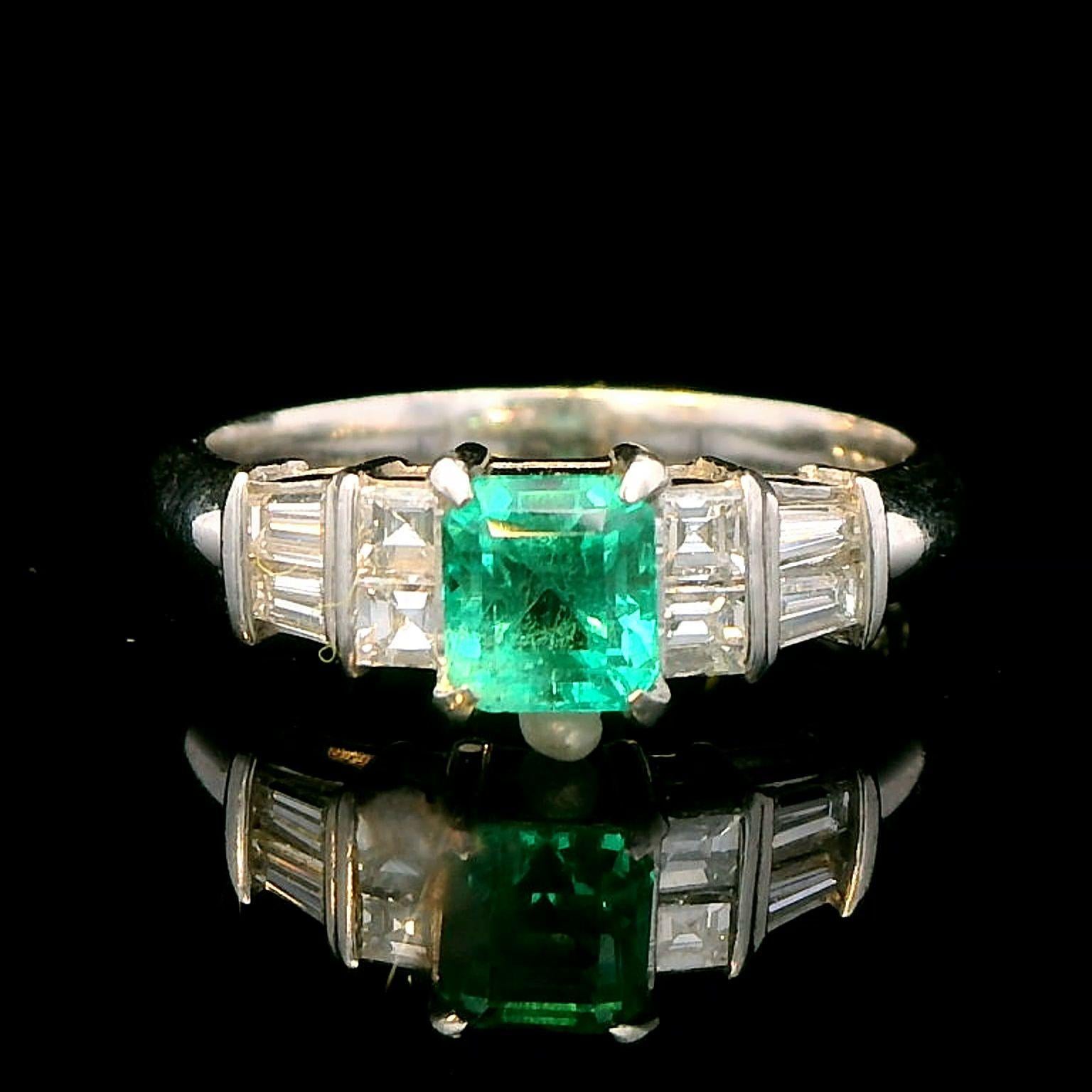 Platinum Ring with 0.55ct Emerald and 0.38ct Diamond