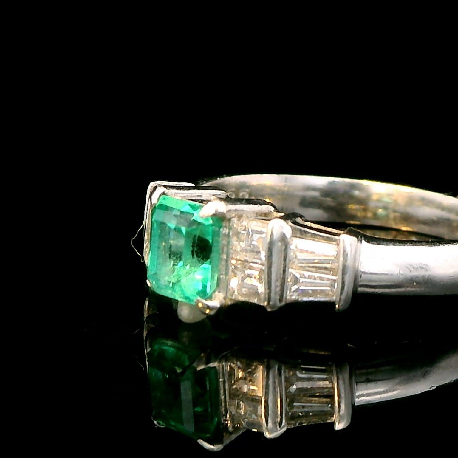 Platinum Ring with 0.55ct Emerald and 0.38ct Diamond