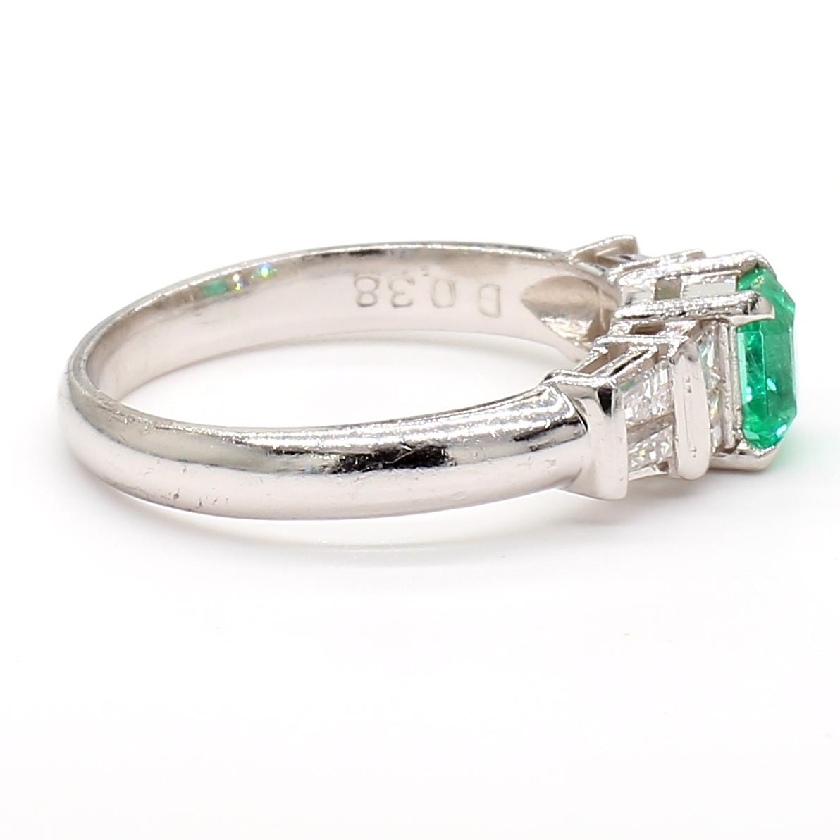 Platinum Ring with 0.55ct Emerald and 0.38ct Diamond