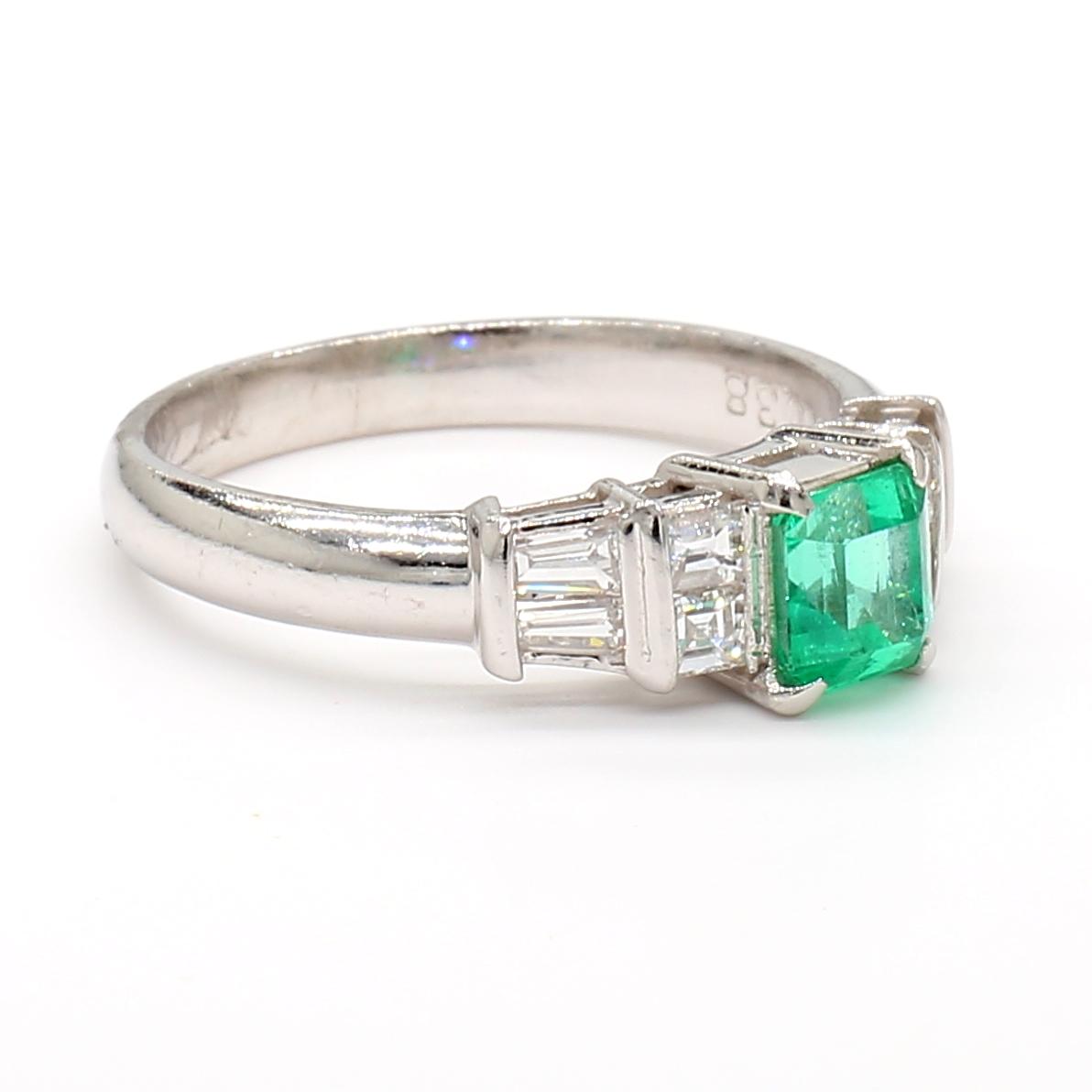 Platinum Ring with 0.55ct Emerald and 0.38ct Diamond