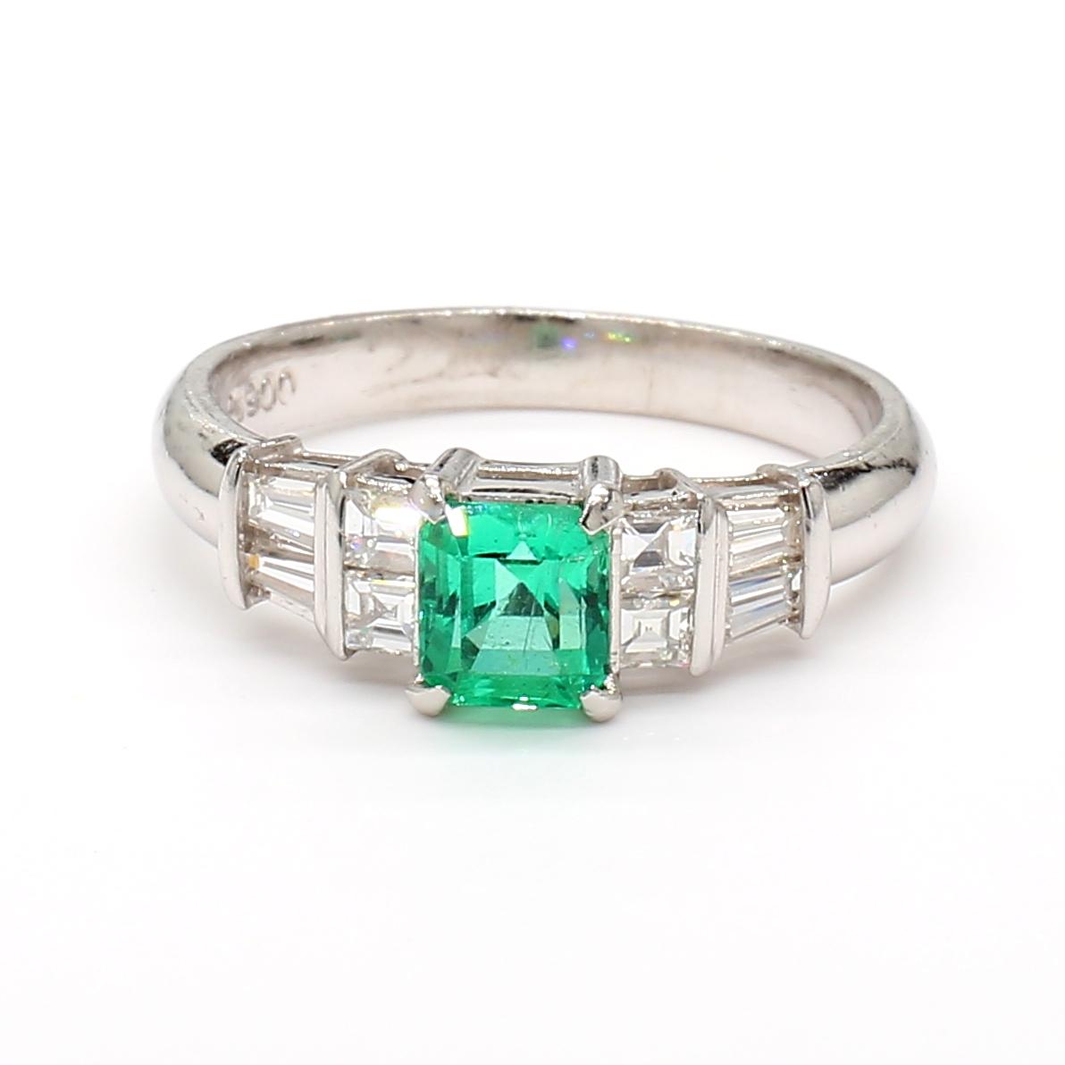 Platinum Ring with 0.55ct Emerald and 0.38ct Diamond